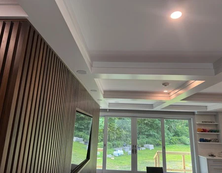 Stained wood slat accent wall in an open living space