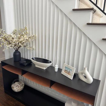Foyer with dark console wall and finished millwork