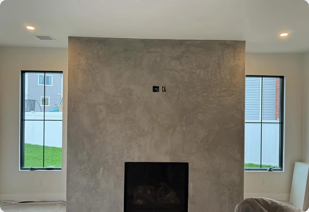 Venetian plaster fireplace surround finished by United Painting of North Texas